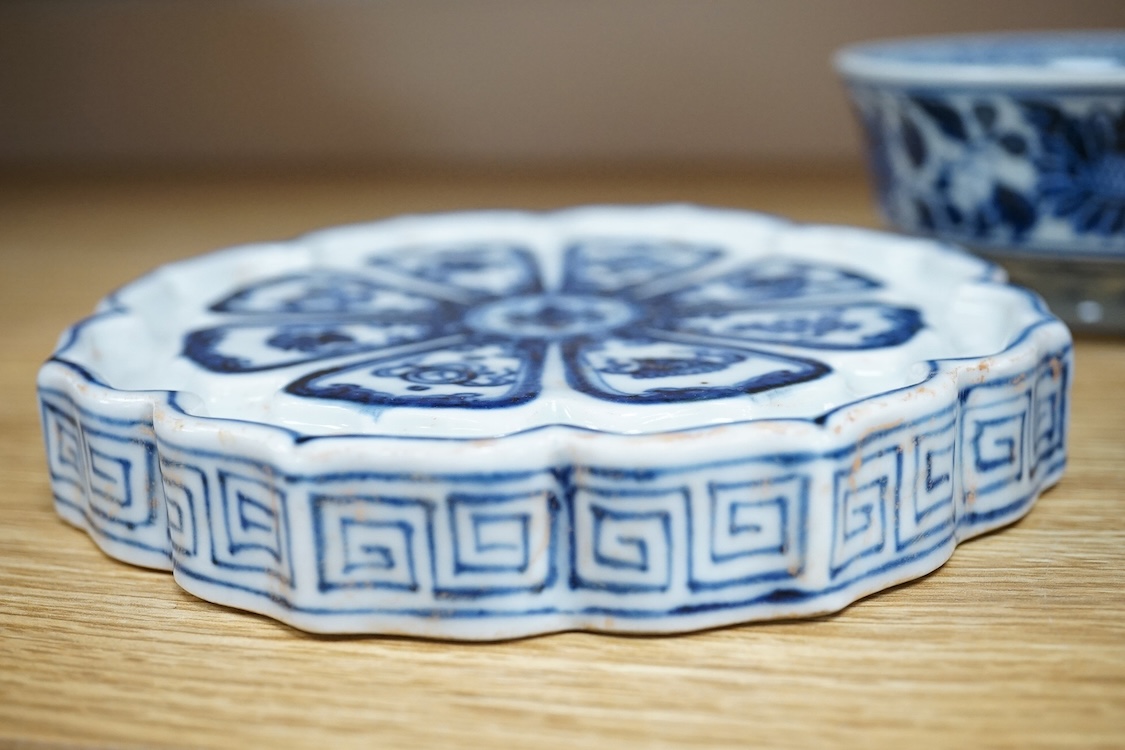 Two Chinese blue and white bowls and a lotus shaped tea pot stand, largest 15cm in diameter